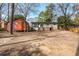 Expansive backyard featuring a shed, patio, and gentle slope ideal for outdoor activities and relaxation at 2542 Warwick Ne Cir, Atlanta, GA 30345