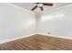 Bright empty bedroom with hardwood floors, white walls, and a ceiling fan at 2542 Warwick Ne Cir, Atlanta, GA 30345