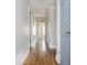 Hallway with hardwood floors and neutral paint at 2542 Warwick Ne Cir, Atlanta, GA 30345