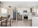 Bright eat-in kitchen features stainless appliances and quartz countertops at 2542 Warwick Ne Cir, Atlanta, GA 30345