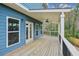 Inviting covered back porch, perfect for outdoor entertaining with wood decking at 3119 Stonegate Sw Dr, Atlanta, GA 30331