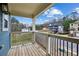 A cozy porch with a view of new construction and trees beyond a black metal railing at 3119 Stonegate Sw Dr, Atlanta, GA 30331