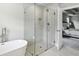 Bathroom featuring a soaking tub and a glass enclosed shower with tile surround at 3119 Stonegate Sw Dr, Atlanta, GA 30331