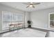 Spacious bedroom with large window, a ceiling fan, and room for a desk at 3119 Stonegate Sw Dr, Atlanta, GA 30331