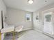 Bright room with modern desk, chair, and a door to the exterior at 3119 Stonegate Sw Dr, Atlanta, GA 30331