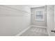A well-organized walk-in closet with shelving and natural light from a window at 3119 Stonegate Sw Dr, Atlanta, GA 30331