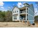 Two-story home featuring a blue and white exterior, complemented by a porch for outdoor relaxation at 3119 Stonegate Sw Dr, Atlanta, GA 30331