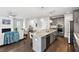 Open-concept kitchen featuring a large island, stainless steel appliances, and hardwood floors at 3119 Stonegate Sw Dr, Atlanta, GA 30331