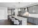 Stylish kitchen with gray cabinets, granite countertops, stainless appliances, and pendant lighting at 3119 Stonegate Sw Dr, Atlanta, GA 30331