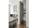 Pantry features wire shelving for storing dishes and kitchen appliances, conveniently located off the kitchen at 9121 Selborne Ln, Chattahoochee Hills, GA 30268