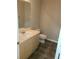 Bathroom featuring tile floor, light wood vanity, and a sink at 2649 Fieldstone View Se Ln, Conyers, GA 30013