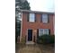 Brick townhouse with a black front door and black shutters on the windows at 2649 Fieldstone View Se Ln, Conyers, GA 30013