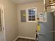 Utility room displaying a water heater, window, and neutral wall color at 2649 Fieldstone View Se Ln, Conyers, GA 30013