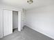 This bedroom features neutral carpet, a closet, and ample natural light at 3180 Oakley Pl, Union City, GA 30291