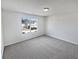 Bright bedroom featuring a neutral color palette, new carpeting, and large window at 3180 Oakley Pl, Union City, GA 30291