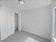 This bedroom features neutral carpet, a closet, and ample natural light at 3180 Oakley Pl, Union City, GA 30291