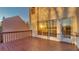 A cozy wooden deck features sunlight streaming into windows of this Stockbridge home at 407 Woodton Knl, Stockbridge, GA 30281