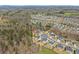 Beautiful aerial perspective of a community with mature trees and landscaped yards at 4205 Rock Creek Dr, Cumming, GA 30028