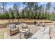 Charming backyard patio with cozy seating, perfect for outdoor gatherings and relaxation at 4205 Rock Creek Dr, Cumming, GA 30028