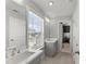 Bright bathroom featuring double sinks, large mirror, and natural light at 4205 Rock Creek Dr, Cumming, GA 30028