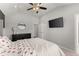 Neutral bedroom offers lots of light, sleek ceiling fan and modern accents at 4205 Rock Creek Dr, Cumming, GA 30028