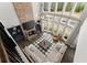 An aerial view of a living room features a fireplace, lots of windows, a large sectional sofa, and modern decor at 4205 Rock Creek Dr, Cumming, GA 30028