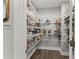 A walk-in pantry with ample shelving space for organized food and kitchen essentials at 4205 Rock Creek Dr, Cumming, GA 30028