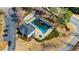 Aerial view of community pool with covered tarp, landscaping, and nearby parking at 4335 Halifax Ne Ter, Roswell, GA 30075