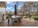 Back deck featuring an outdoor table and seating, perfect for relaxation and entertaining at 4335 Halifax Ne Ter, Roswell, GA 30075