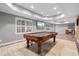 Finished basement area with a pool table, recessed lighting, a mini bar, and a window at 4335 Halifax Ne Ter, Roswell, GA 30075