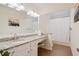 Well-lit bathroom featuring a vanity with granite countertops, a makeup area, and a shower/tub combination at 4335 Halifax Ne Ter, Roswell, GA 30075