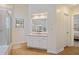 Modern bathroom featuring white cabinets, tile floors, a large mirror, and a walk-in shower at 4335 Halifax Ne Ter, Roswell, GA 30075