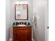 Charming bathroom with a wood vanity and framed mirror at 4335 Halifax Ne Ter, Roswell, GA 30075