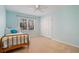 Well-lit bedroom with a cozy bed, a ceiling fan, and a window overlooking the outdoors at 4335 Halifax Ne Ter, Roswell, GA 30075