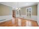 Elegant dining room with hardwood floors, chair railing, and two shuttered windows at 4335 Halifax Ne Ter, Roswell, GA 30075