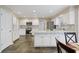 Updated kitchen featuring white cabinets, stainless steel appliances, and a kitchen island at 4335 Halifax Ne Ter, Roswell, GA 30075