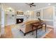 Cozy living room featuring a fireplace, built-in shelving, and hardwood floors, perfect for relaxation at 4335 Halifax Ne Ter, Roswell, GA 30075