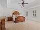 Spacious main bedroom with tray ceiling, plush carpet, and ample natural light from shuttered windows at 4335 Halifax Ne Ter, Roswell, GA 30075