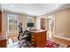 Bright office space featuring wood floors, shutters, built-in shelves, and a large desk at 4335 Halifax Ne Ter, Roswell, GA 30075