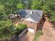 Aerial view of the exterior of the home with beautiful trees and landscaping at 460 Rabbit Run, Mcdonough, GA 30252