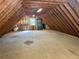 Unfinished attic space with exposed wooden beams and plywood floors at 460 Rabbit Run, Mcdonough, GA 30252