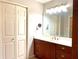 Well lit bathroom with a large mirror, a vanity, and a linen closet at 460 Rabbit Run, Mcdonough, GA 30252