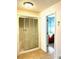 Well-lit bathroom with a glass-enclosed shower and a view of the vanity at 460 Rabbit Run, Mcdonough, GA 30252