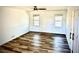 Bright bedroom with warm hardwood flooring and natural lighting from the windows at 460 Rabbit Run, Mcdonough, GA 30252