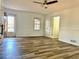 Open bedroom with hardwood flooring with two doors and a window providing natural light at 460 Rabbit Run, Mcdonough, GA 30252