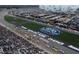 Aerial view of a vibrant race track filled with crowds and racecars on the Atlanta Motor Speedway at 460 Rabbit Run, Mcdonough, GA 30252