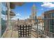 Enjoy city views from this condo balcony, complete with metal furniture and room to enjoy the outdoors at 400 W Peachtree Nw St # 1408, Atlanta, GA 30308