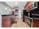 Modern kitchen featuring granite countertops, stainless steel appliances, and an open floor plan at 400 W Peachtree Nw St # 1408, Atlanta, GA 30308