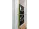 Compact laundry area featuring stacked washer and dryer units at 400 W Peachtree Nw St # 1408, Atlanta, GA 30308