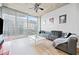 Bright living room with expansive windows and a modern, comfortable seating area at 400 W Peachtree Nw St # 1408, Atlanta, GA 30308